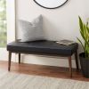 upholstered bench in black and cream faux leather