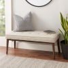 upholstered bench in black and cream faux leather