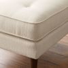 upholstered bench in black and cream faux leather